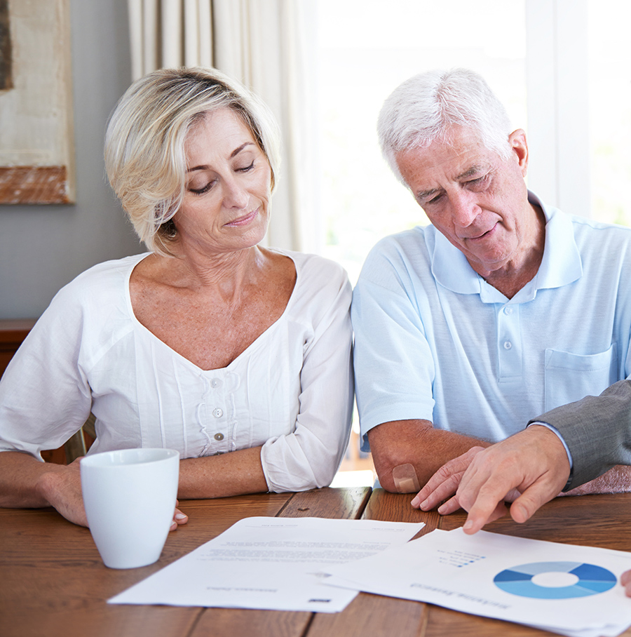 Older Couple getting advice from their financial advisor